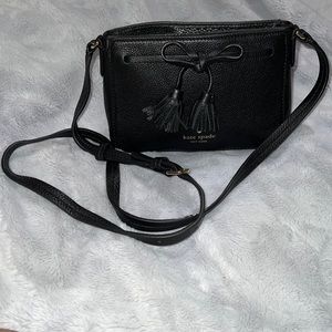 Black Kate Spade bag with a bow